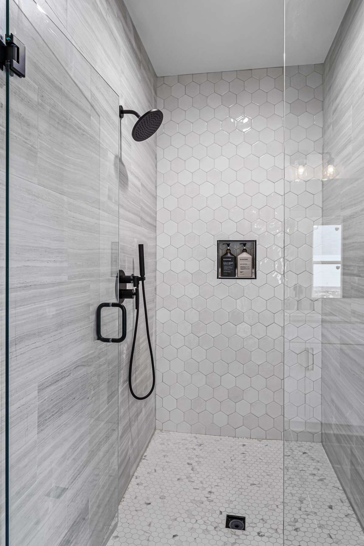 Large, Custom Tiled Primary Shower with Beautiful Finishes.