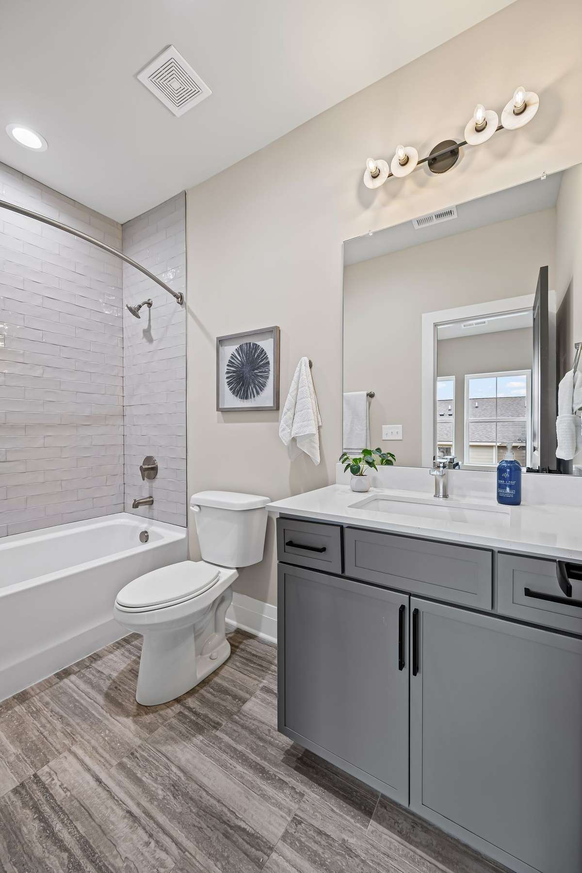 Spacious Third Bathroom Combo with Custom Tiled Shower to the Ceiling