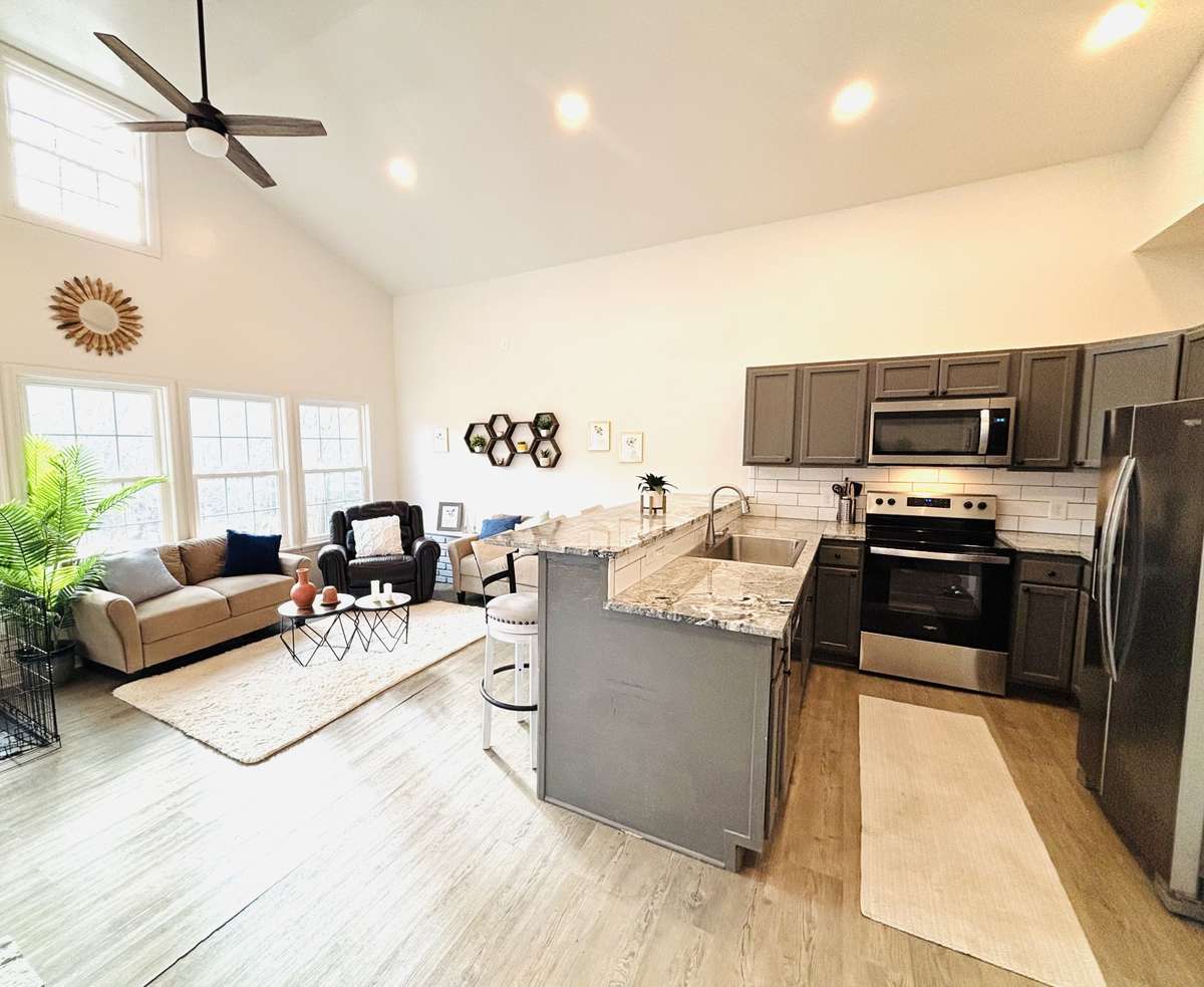 High ceilings help bring in natural lighting. Ceiling fans help circulate the air.