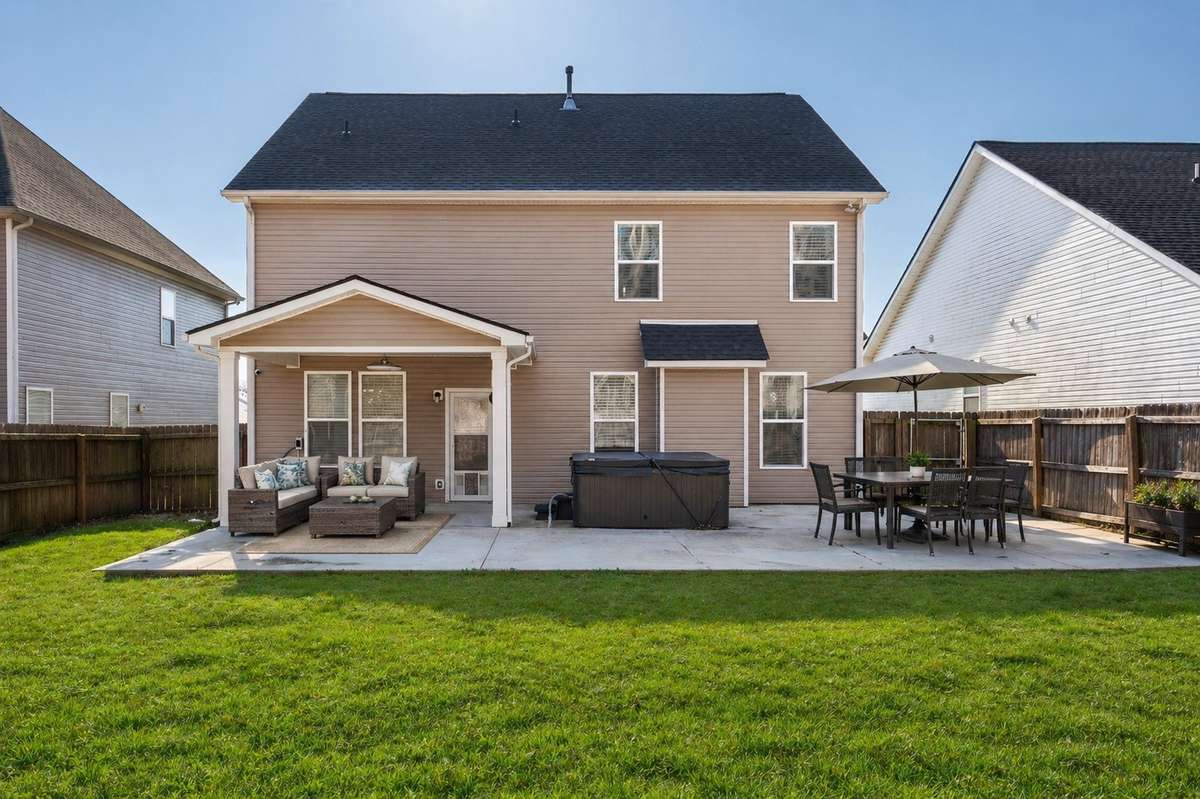 Enhanced & Staged – Imagine this space in the summer with lush green grass and outdoor furniture!