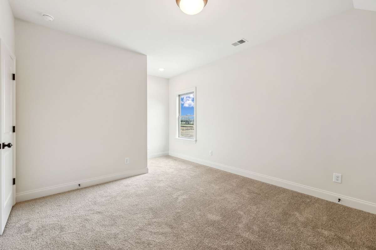 Bedroom 5 is located upstairs