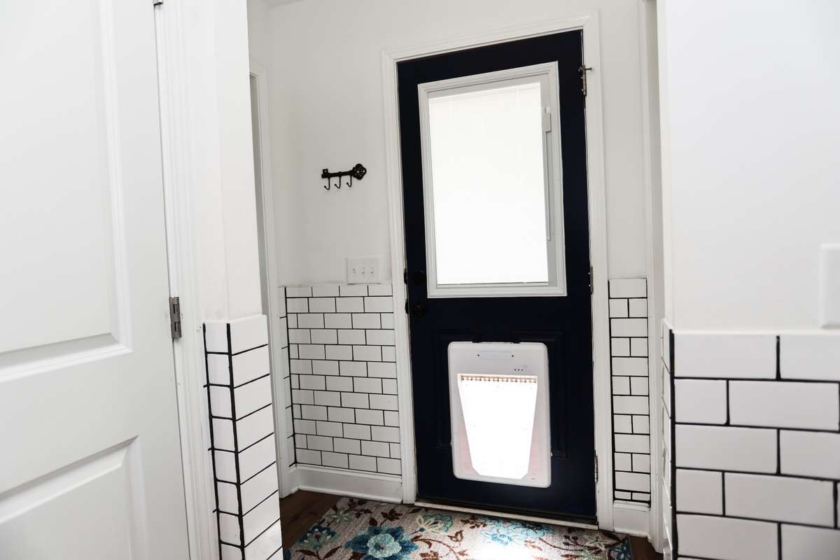 Back Door leading to Back Porch and Fenced in Yard.  Dog door can be locked  or use sensor included and installed on dog collar to automatically open when dog gets close to the door