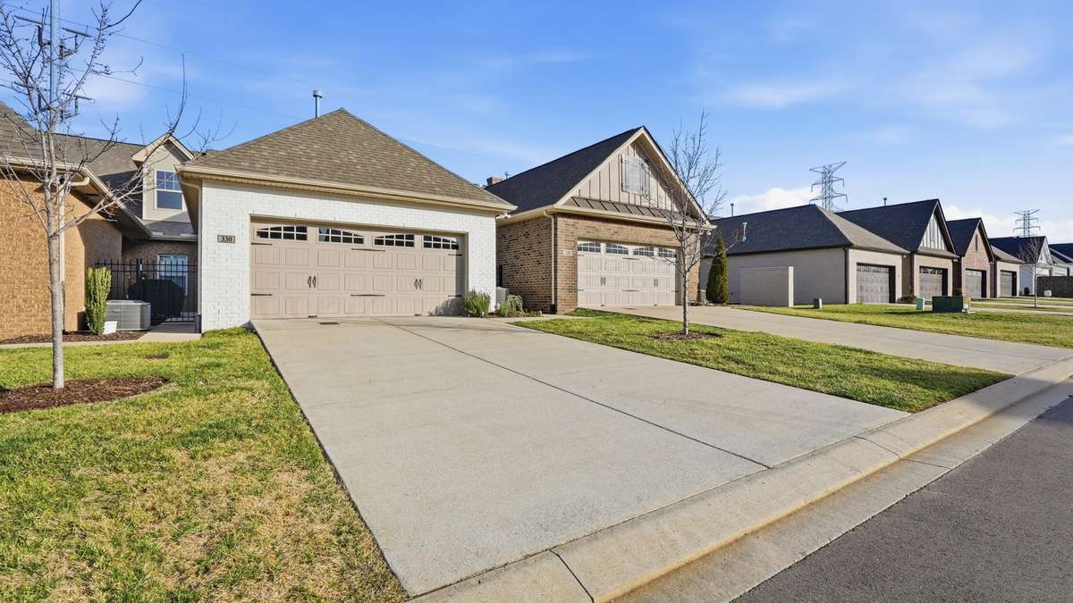 Two car garage and large parking pad for 4 cars.
