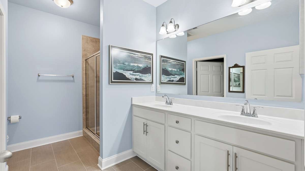 Primary bathroom with double vanities.