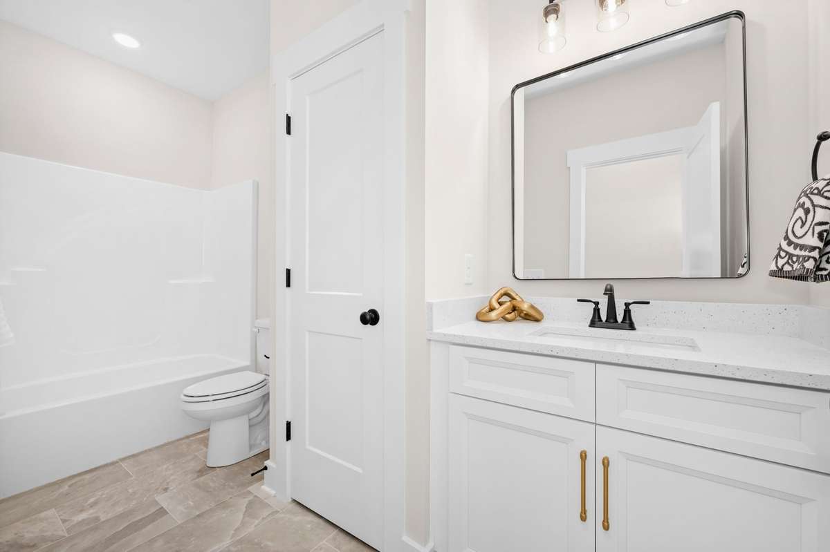 2nd bathroom adjoins guest bedroom on main floor.