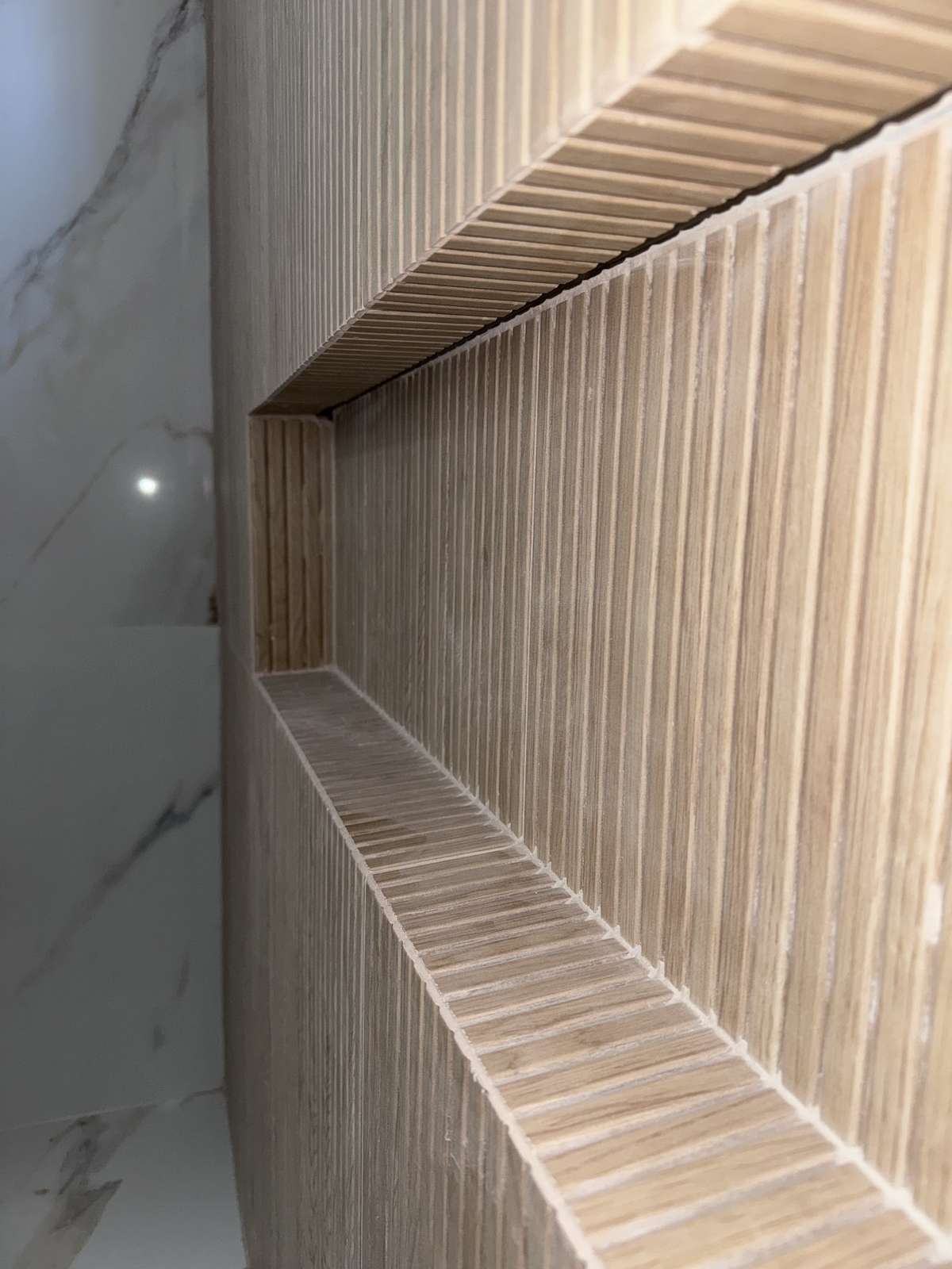 Primary shower tile and fixtures close-up