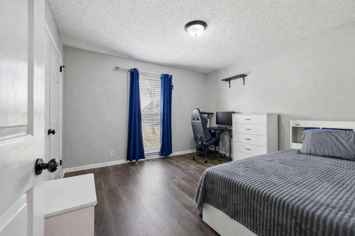 Guest Bedroom 1 on the Main Level 

Photo has been virtually enhanced for marketing purposes