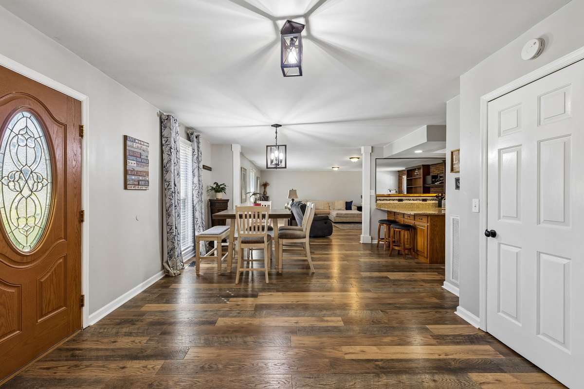 Stunning Open Floor Plan with LVP Flooring throughout Main Living Area