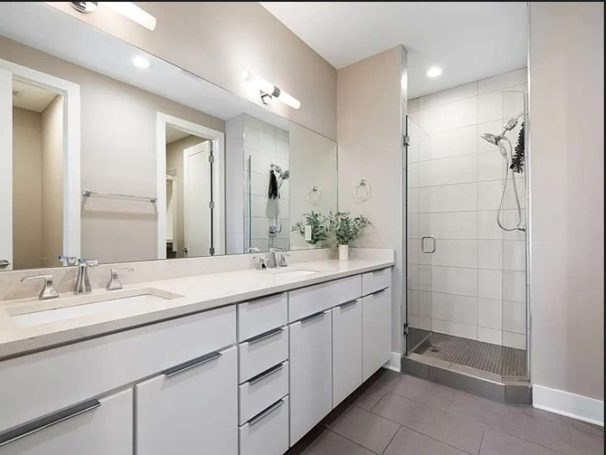 master bathroom, double vanity, fully tiled floor to ceiling shower