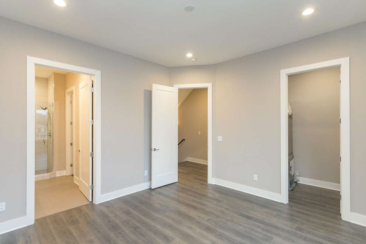 master bedroom, en suite master bathroom, separate toilet room and master closet within the bathroom
