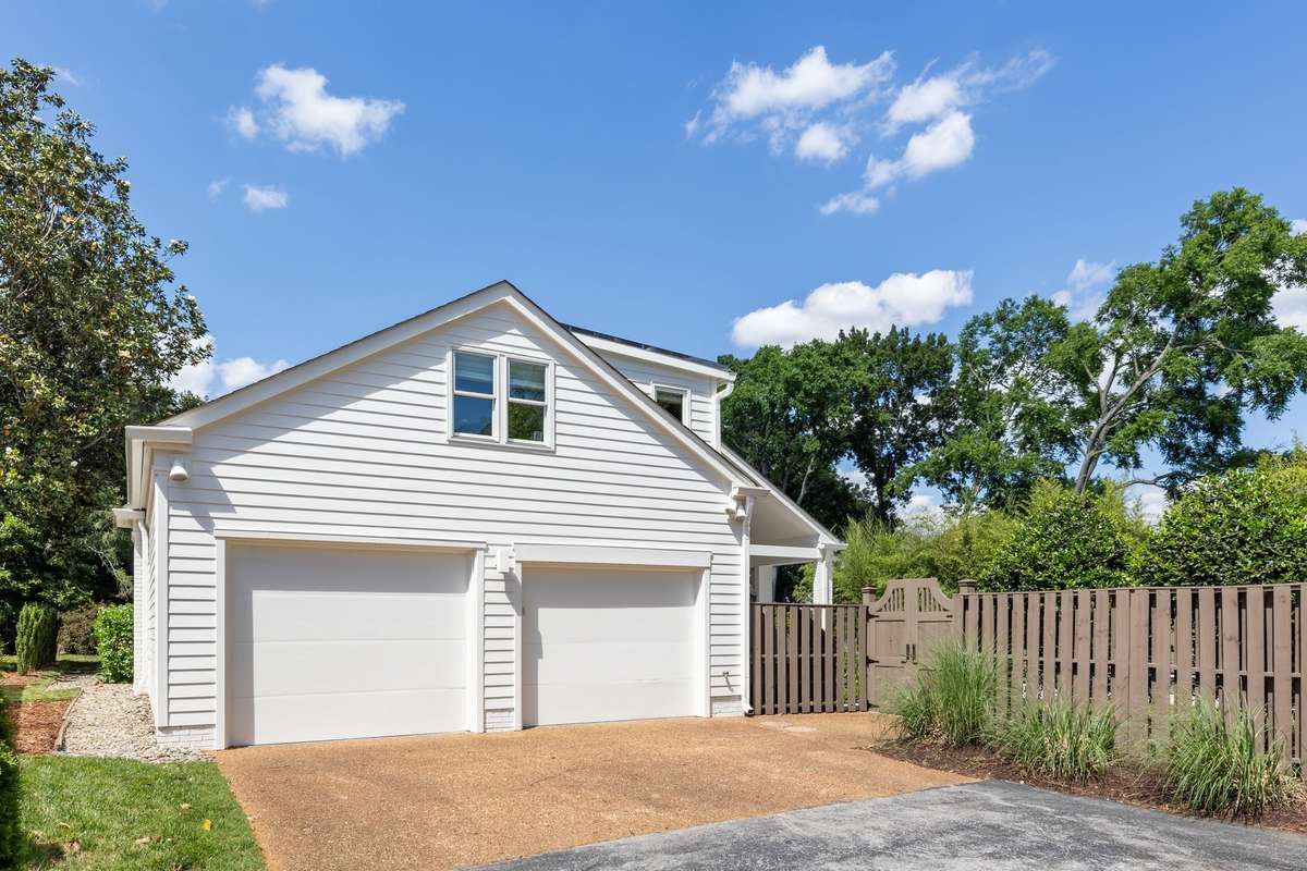 The left garage door is taller to accommodate a taller than average vehicle