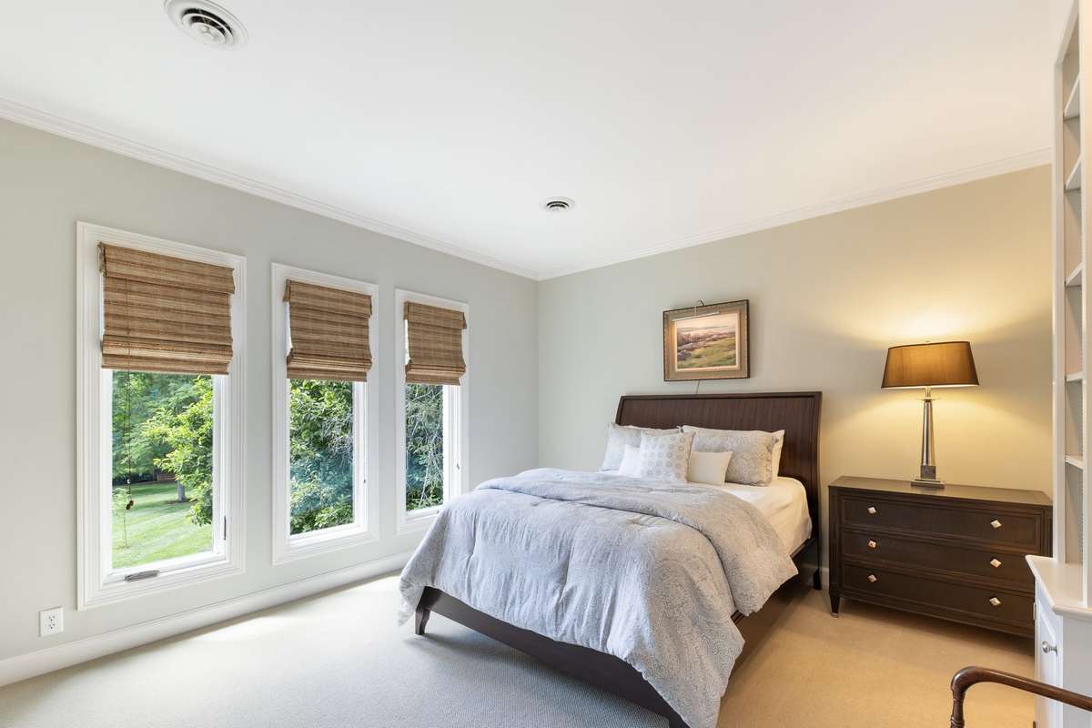 Guest bedroom #1 with build in cabinetry and shares a Jack & Jill bath with guest bedroom (Previously Furnished)