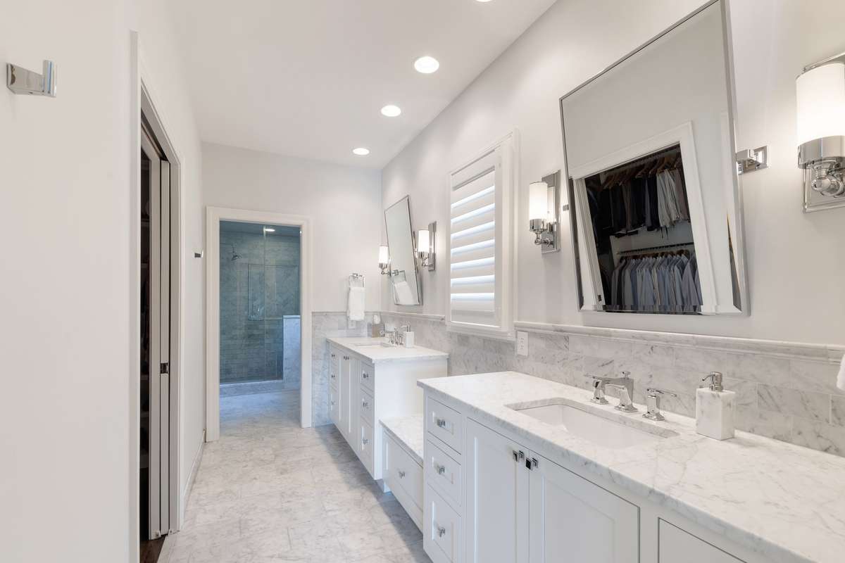 Primary bath with Carrera marble. The bath floor is heated.