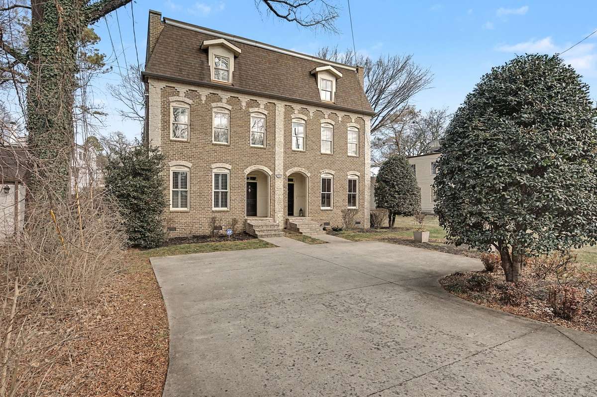 The home is on the left, featuring a shared parking pad for guests with one spot and easy access to all things Green Hills has to offer