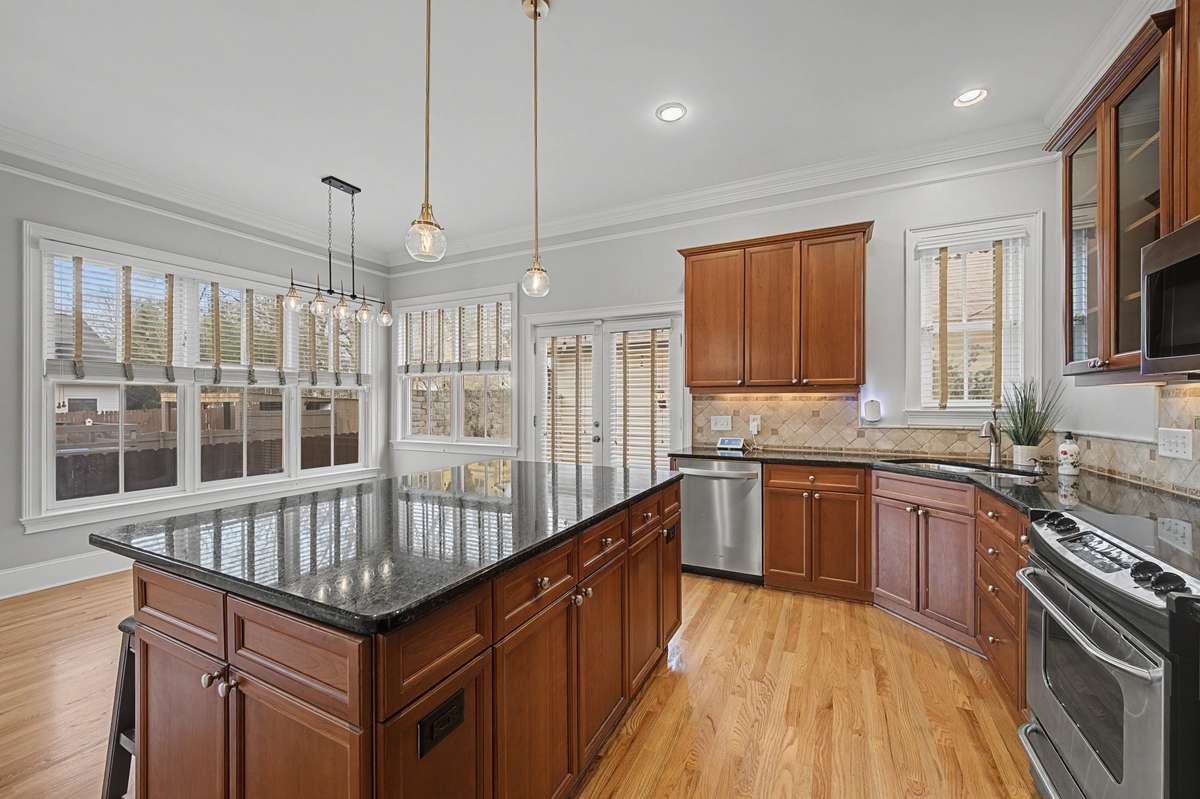 Kitchen: Large kitchen island with breakfast bar seating and stylish pendant lighting