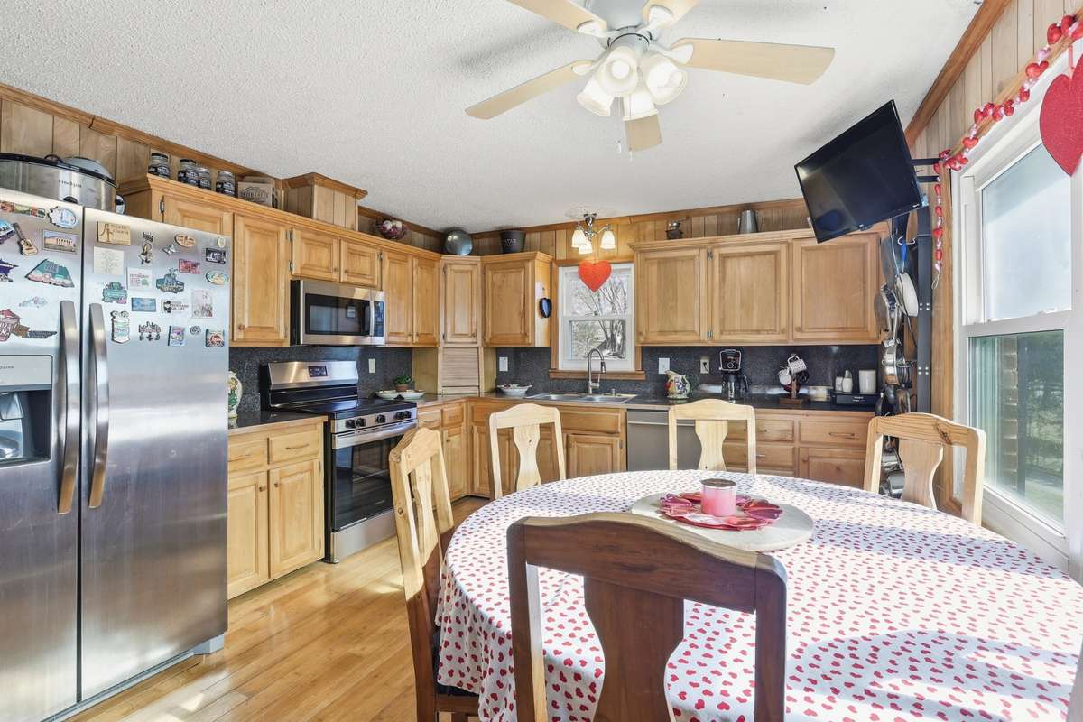 This Kitchen has loads of cabinet space and the stainless steel appliances remain.