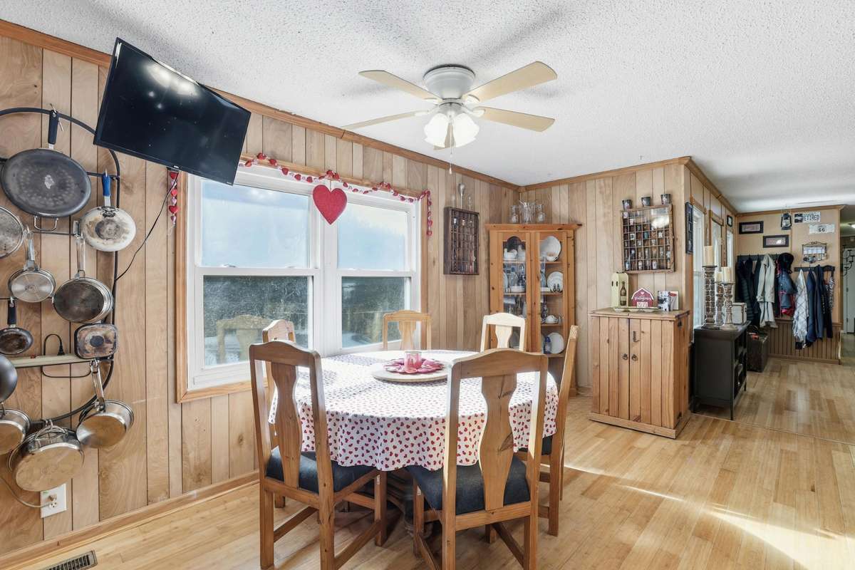 Enjoy your meals in front of windows that overlook the expansive front lawn and hillside.