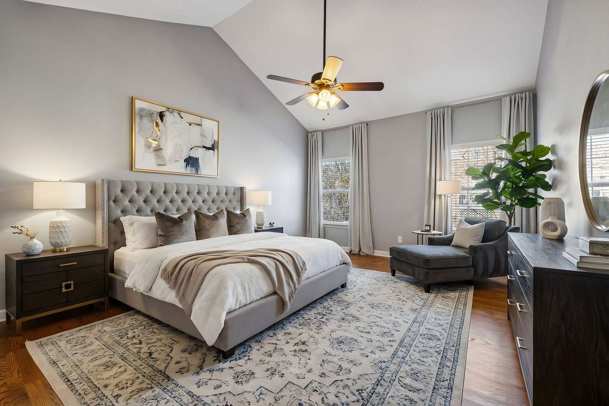 Primary Suite on the main floor with vaulted ceiling and hardwood floors! Virtually staged.