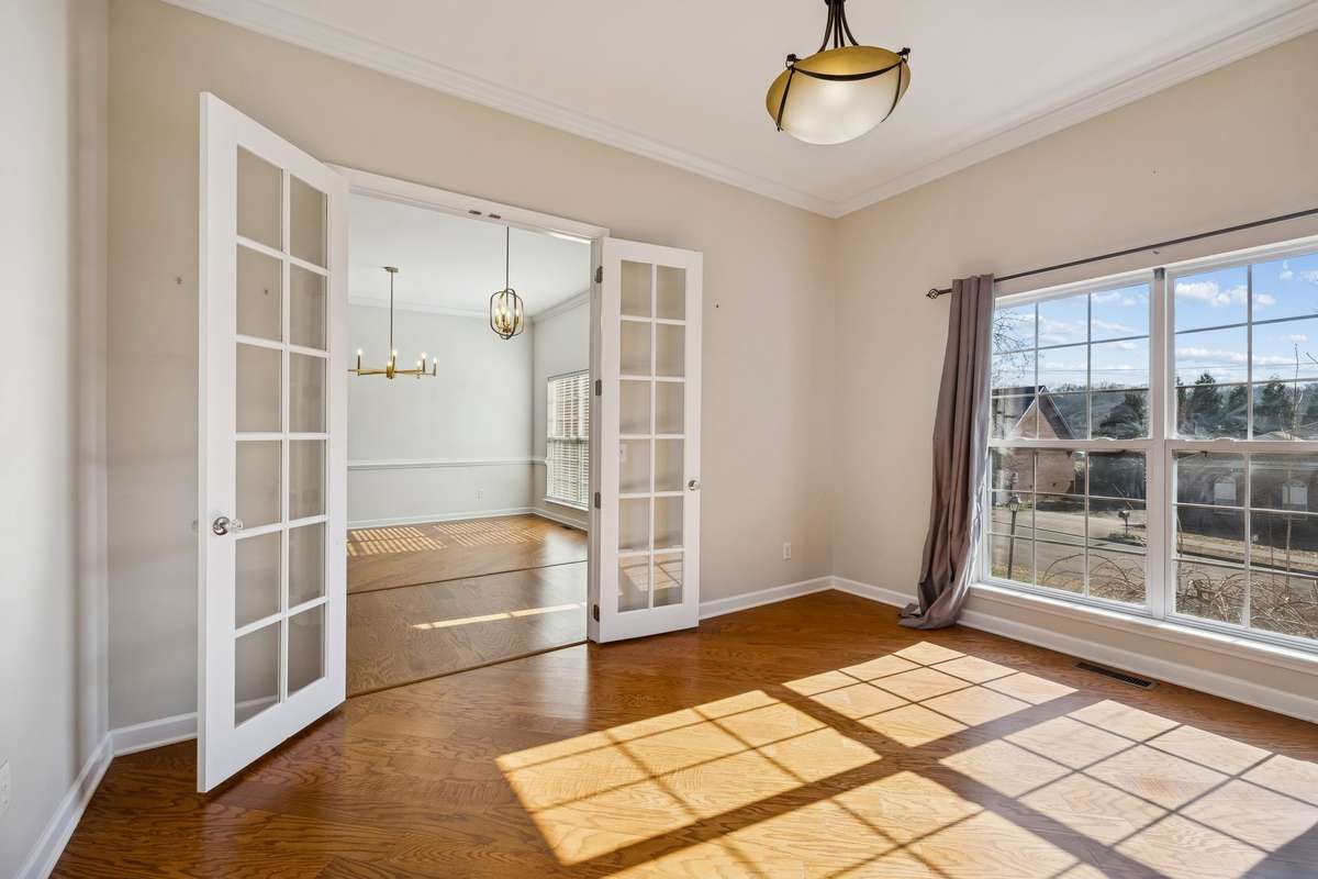 Home office with large windows and french doors!