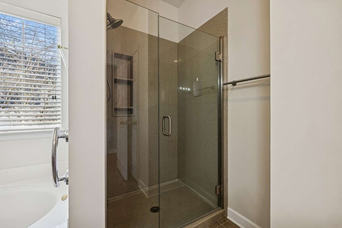 Shower in master bathroom with frameless glass shower door!