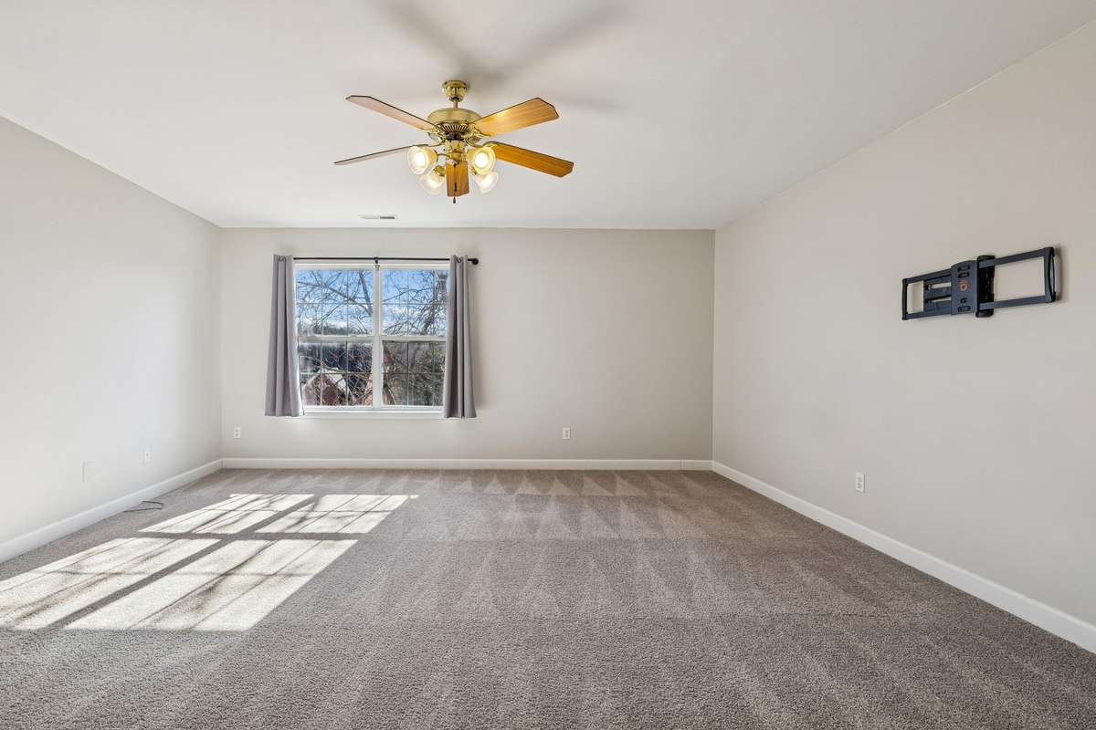 Upstairs bonus room with lots of natural light, full bathroom, and another walk-in closet!