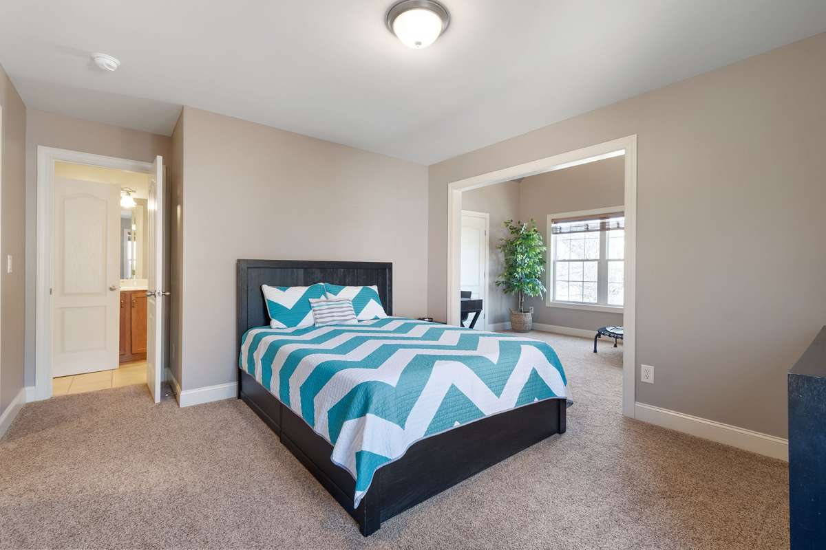 The layout allows for separation between sleeping and secondary living or work areas.