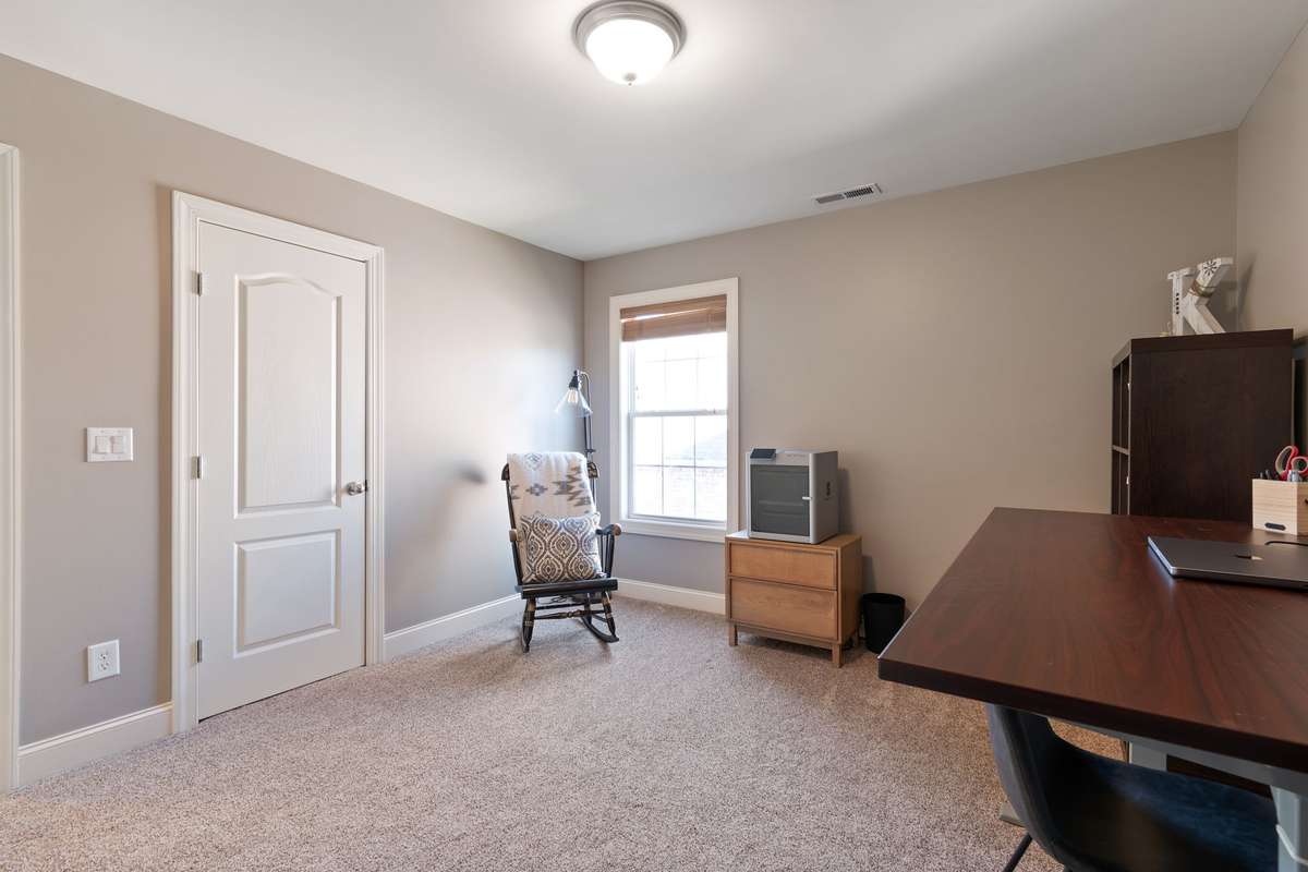 The room’s layout easily offers space for a desk, seating, or a full bedroom set.