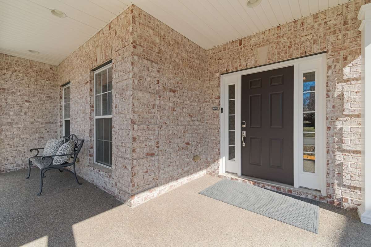 The spacious front porch provides a comfortable outdoor space for relaxing or sipping that morning coffee.