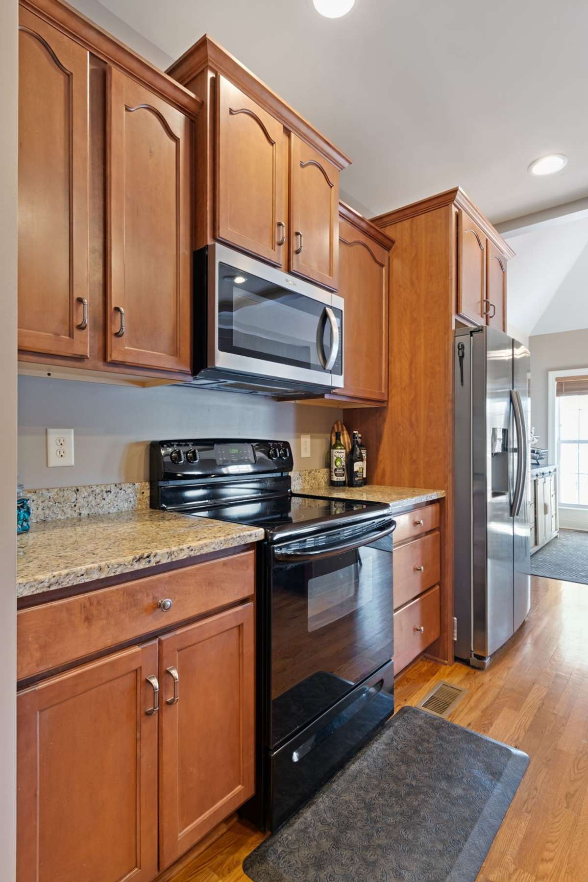 Additional cabinetry and counter space provide functional storage and workspace options.