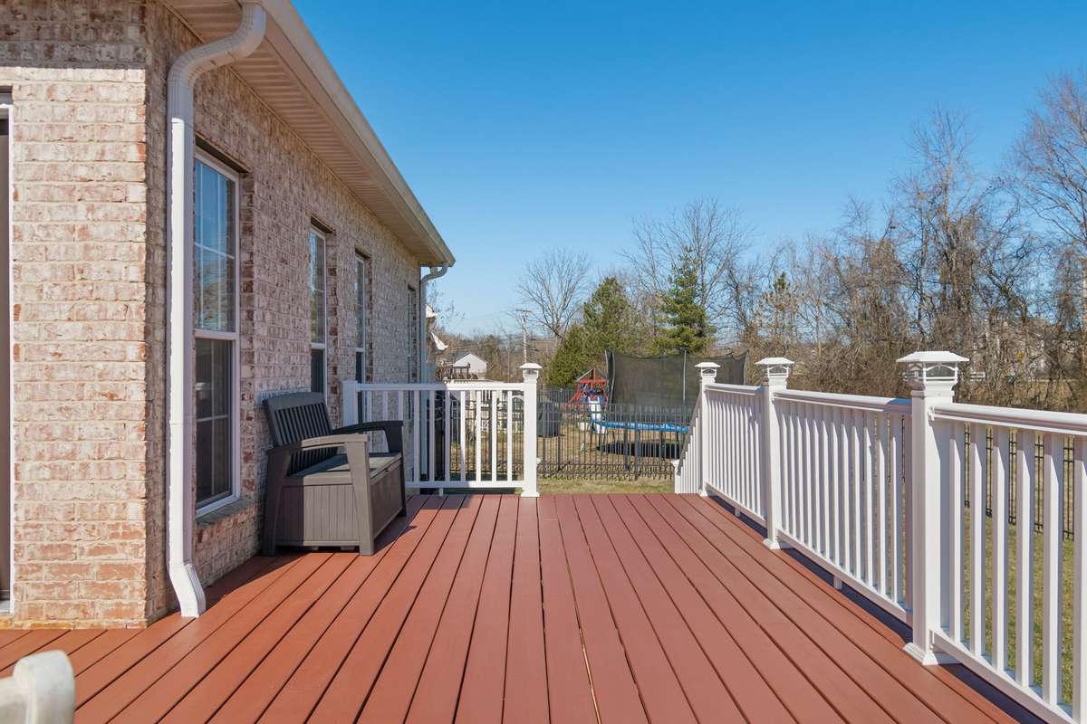 The deck is positioned off the rear of the home, offering privacy and outdoor enjoyment.