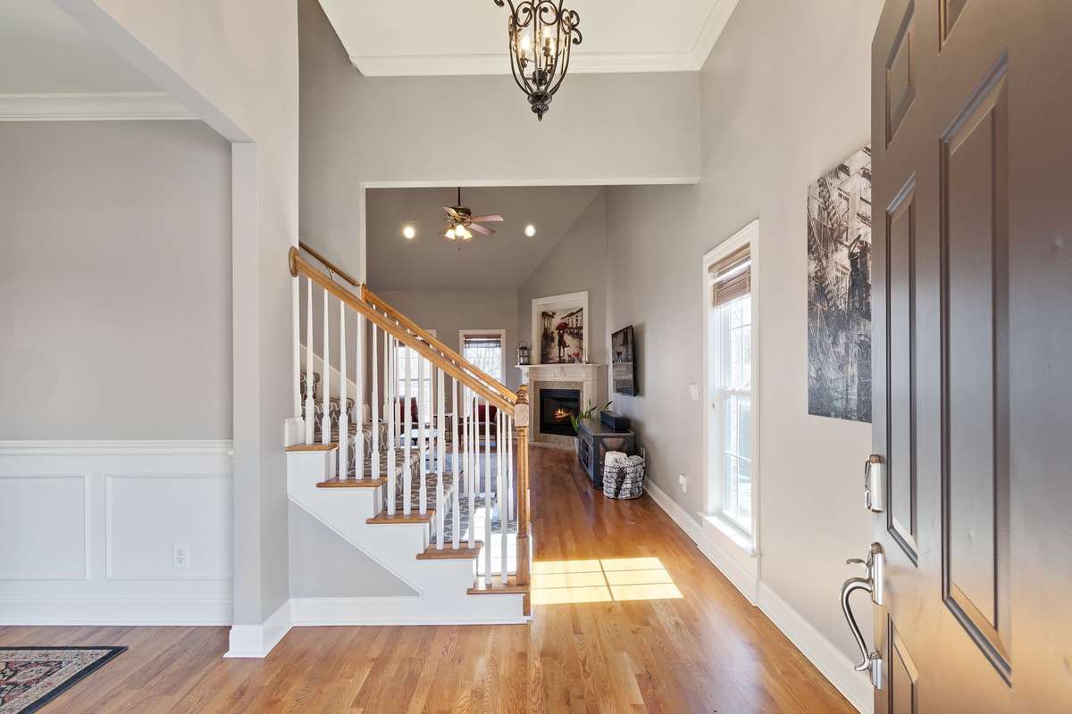 The foyer welcomes you with hardwood floors and flows into the main living areas.