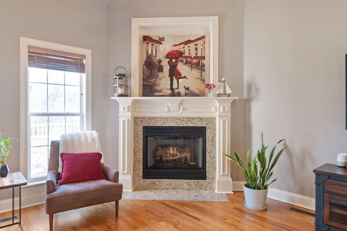 A cozy gas fireplace adds warmth and charm to the living room.