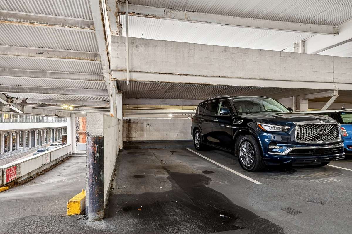 The unit conveys with parking spot 715.