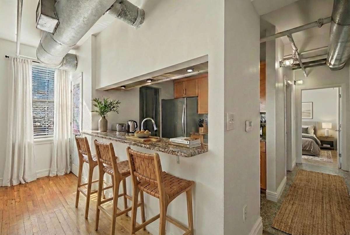 The kitchen offers great bar seating, perfect for casual dining, entertaining, or enjoying morning coffee. *Virtually Staged*