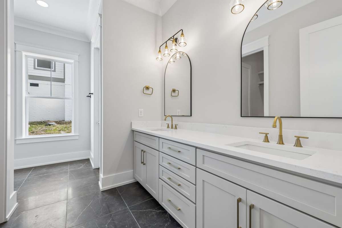 Downstairs Primary - Master En-suite Bathroom with double vanities