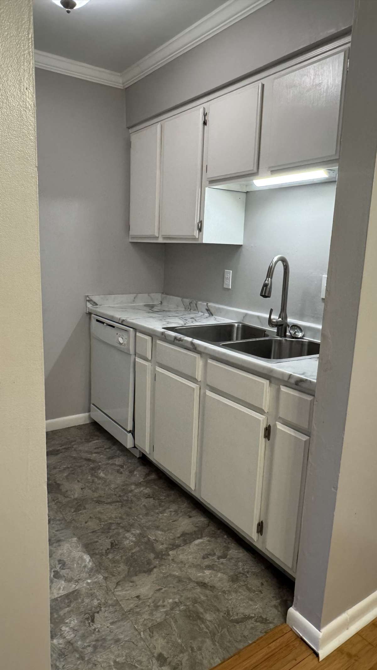 A Galley Kitchen is just the right size for one or two cooks to get stirring.  The Dishwasher is new, and the refrigerator is just a couple of years old.