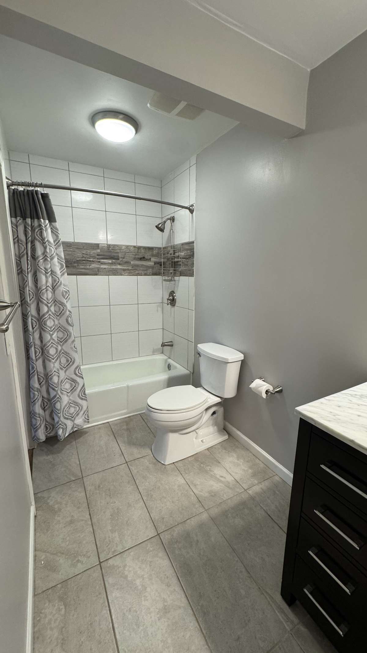 The Bathroom was remodeled within the past couple of years with modern features for your enjoyment.  During the remodel, the wall separating the vanity and water closet areas was removed to open up and enlarge the overall space.