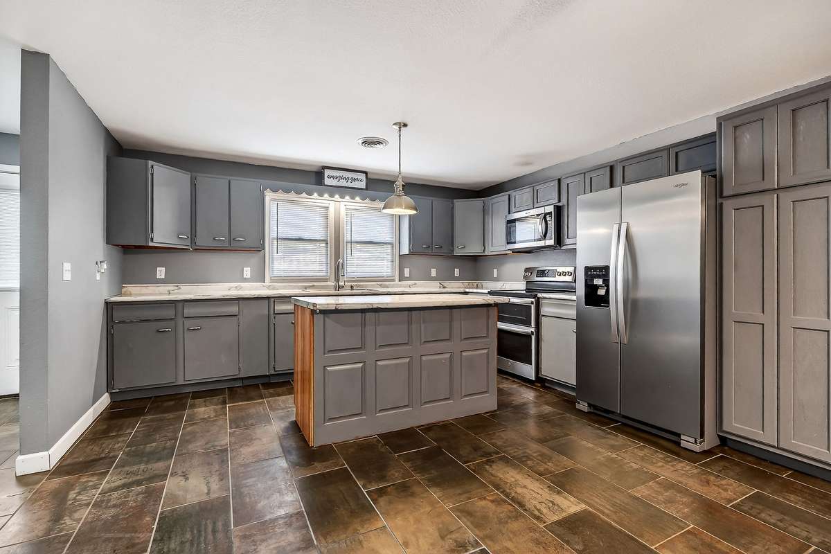 ISLAND KITCHEN WITH TILE FLOORING