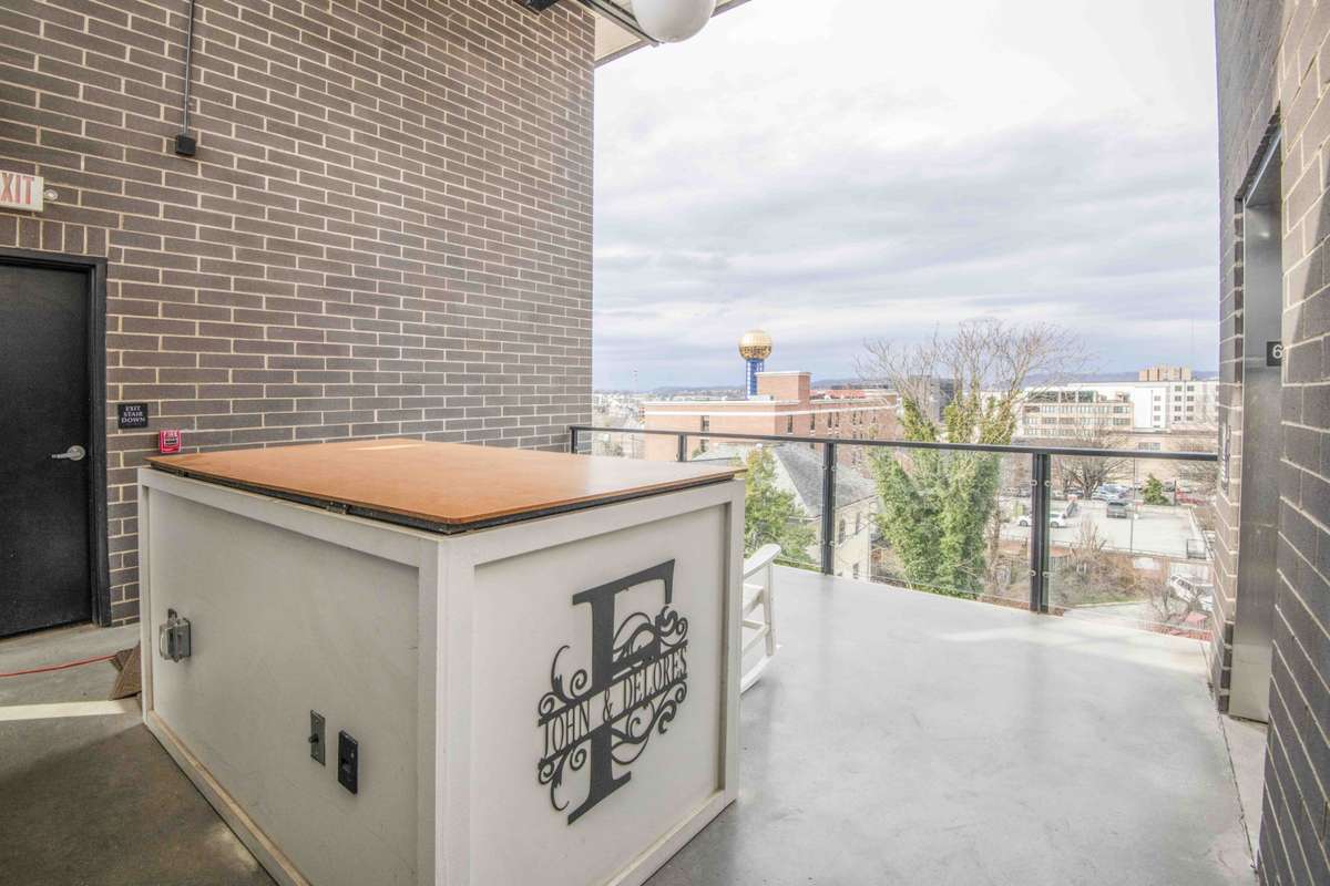 storage on front terrace with emergency stairwell