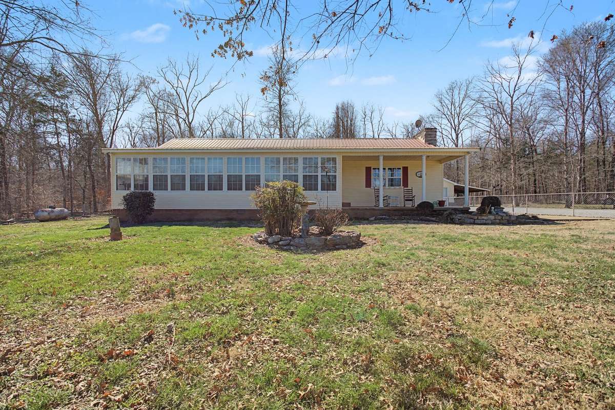 Welcome home to 1545 Irwin Drive in Lewisburg TN! 2079 sqft Farm Cottage, 103+ level  acres with 2 car detached garage and large storage shop