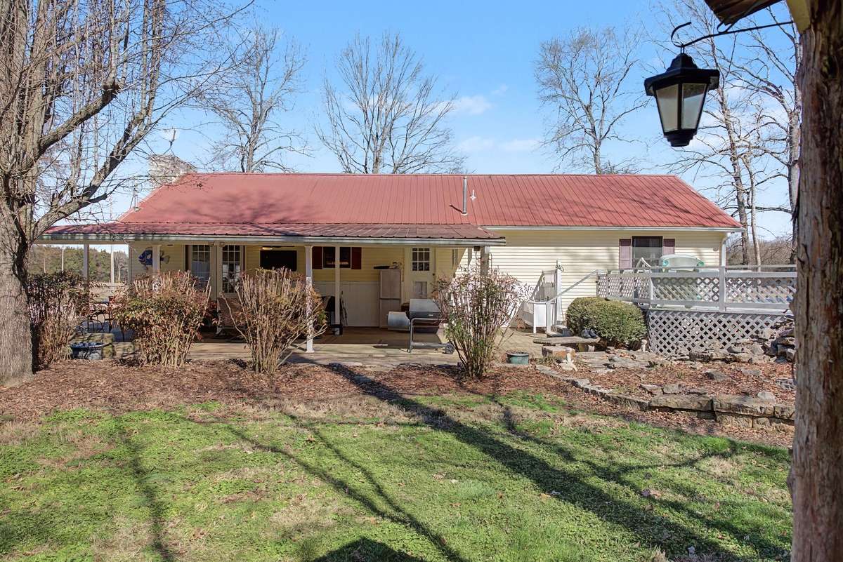 Back view of house Metal roof, with large covered patio
