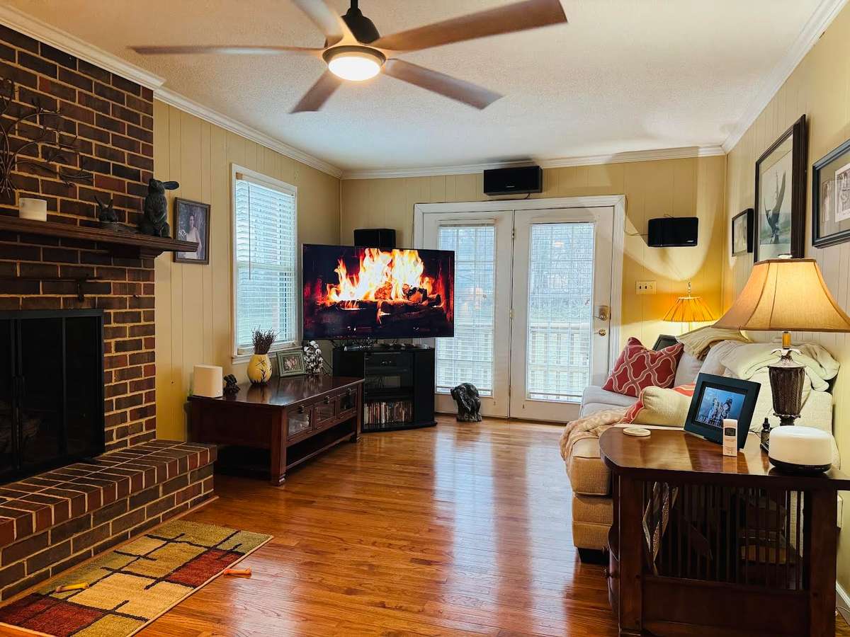 AWWWW!  THE MOST COMFY FAMILY ROOM EVER!!  ON THE END OF HOME WITH A GAS FIREPLACE & GORGEOUS WOOD FLOORS.  DOORS LEAD TO DECK.