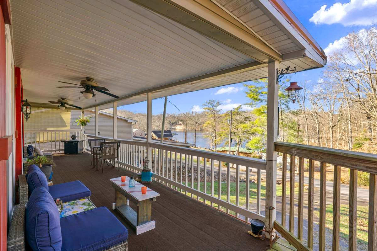 Wrap-around porch perfect for entertaining. View of Chalk Bluff & Whiskey Bay.
