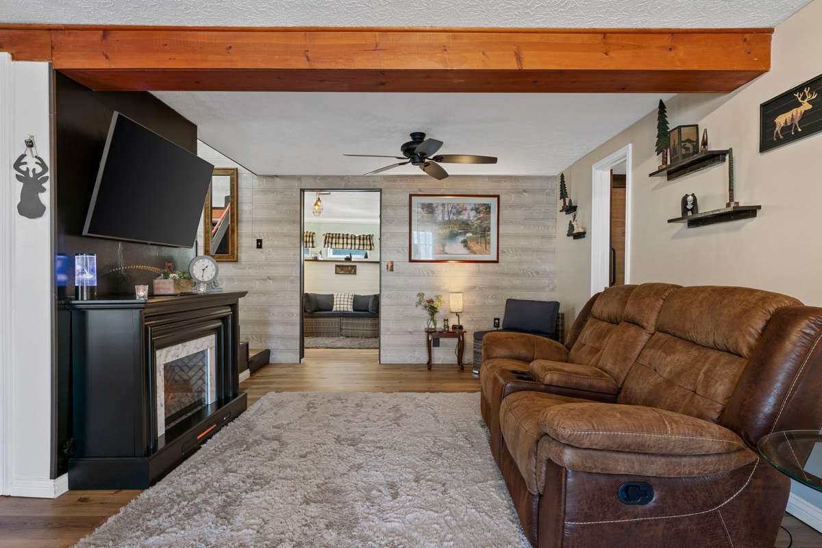 Living Room w/electric fireplace & view to bonus room/office.