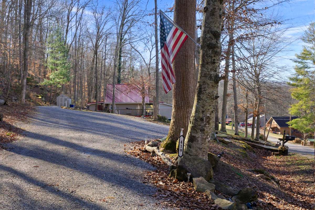 Second lot has established driveways, water, electric & septic - perfect for adding home/rental!