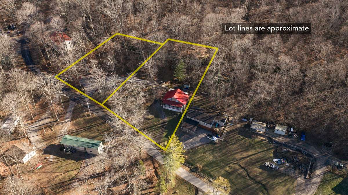 2 lots (.57 acres) - dbl driveways, water, electric & septic - perfect for adding additional home.