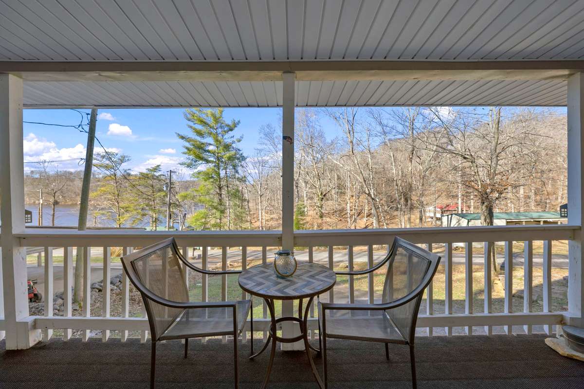 Wrap-around porch perfect for entertaining. View of Chalk Bluff & Whiskey Bay.