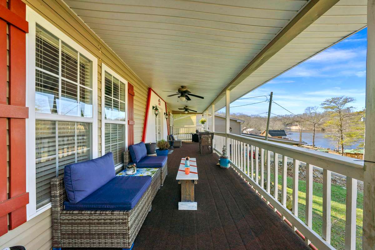 Wrap-around porch perfect for entertaining. View of Chalk Bluff & Whiskey Bay.