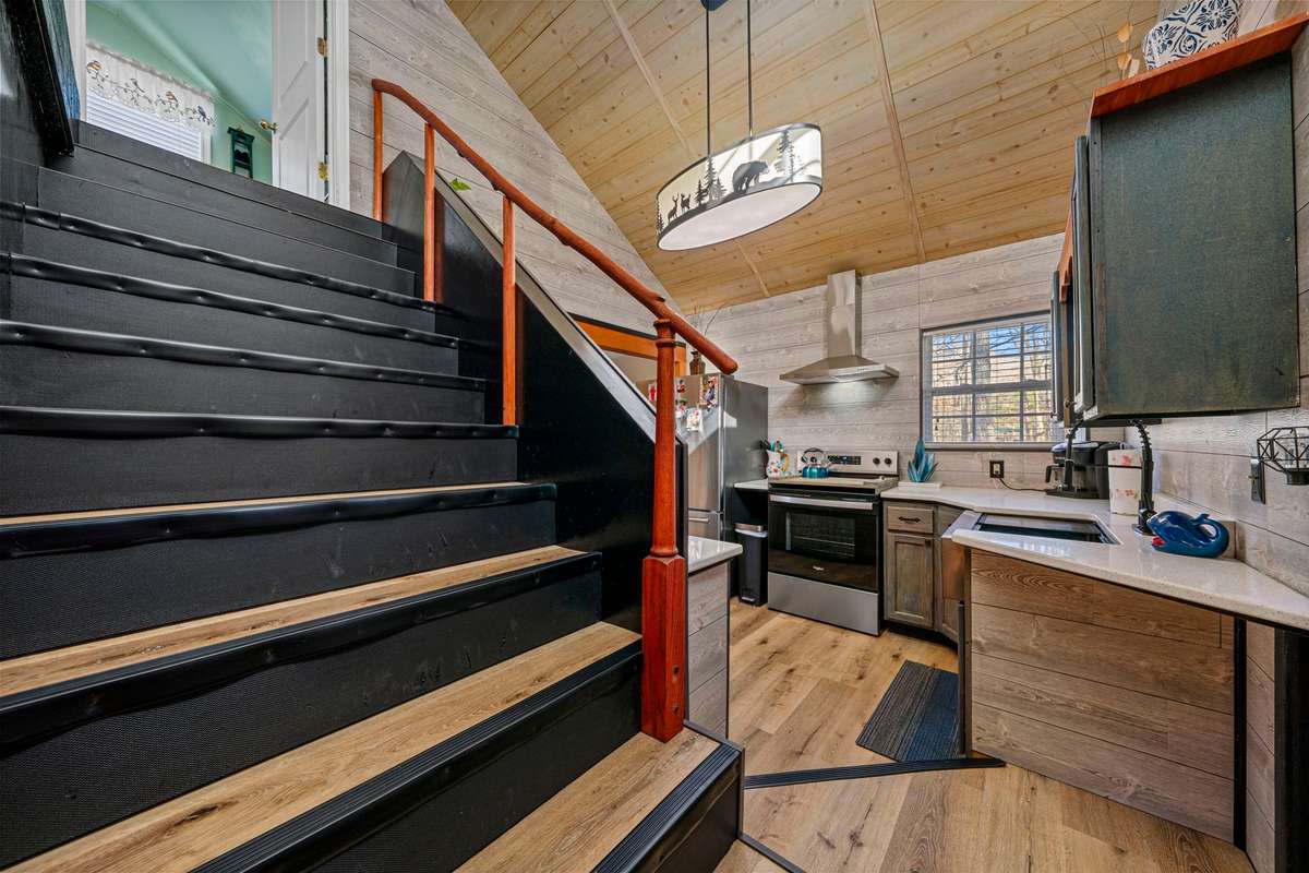 Stairs to upper floor, 2 bedrooms & 1/2 bath.