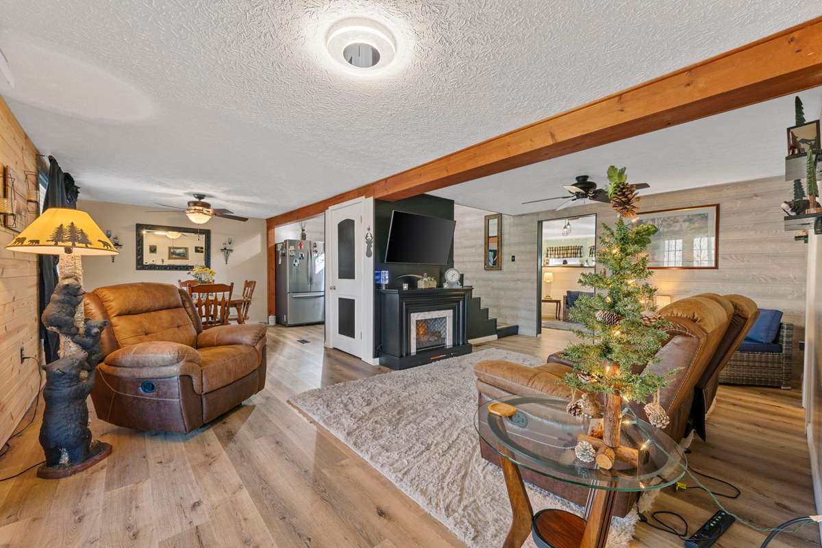 Main floor view of living room, dining room & kitchen.